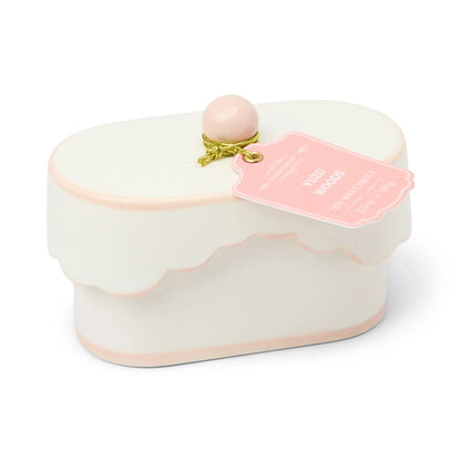 Yuzu Woods Chérie 5.5 oz ceramic candle with light pink accents and scalloped lid