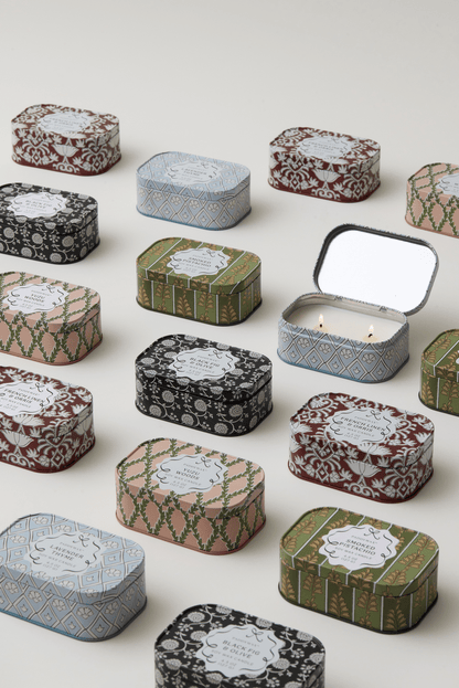 Chérie tin candles arranged with an open Yuzu Woods tin